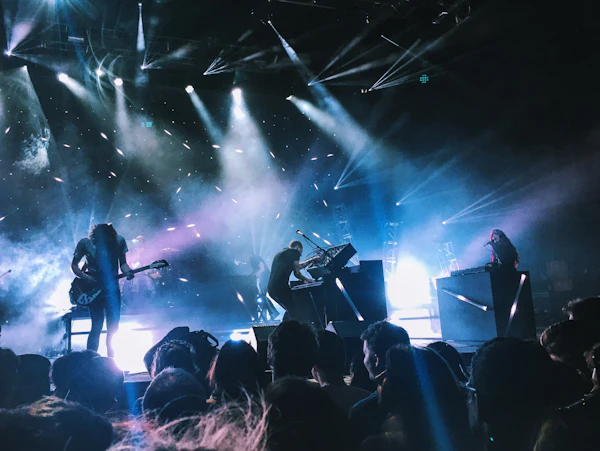 A band on stage under blue lights